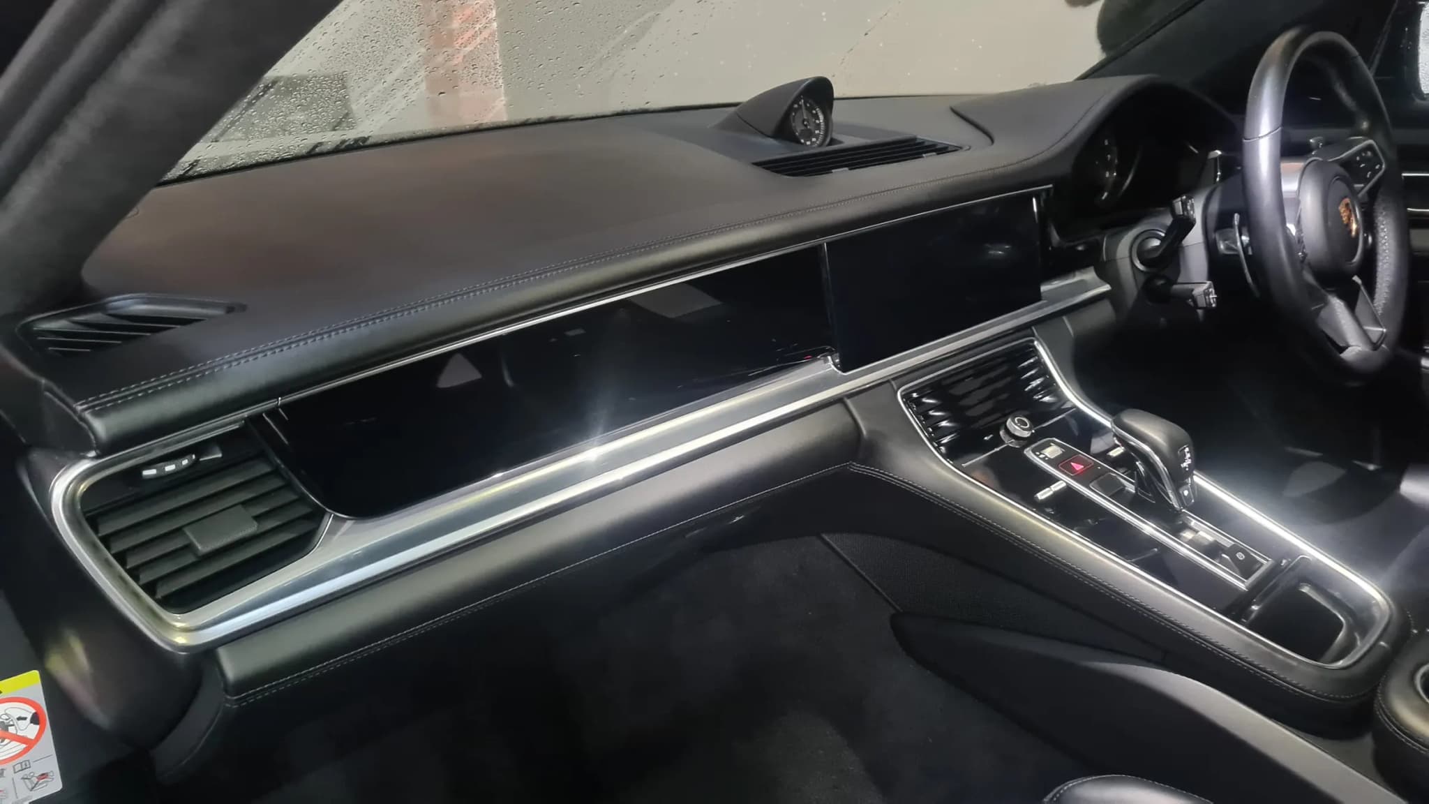A cleaned Porsche dashboard, centre console and switchgear photographed from the passenger side