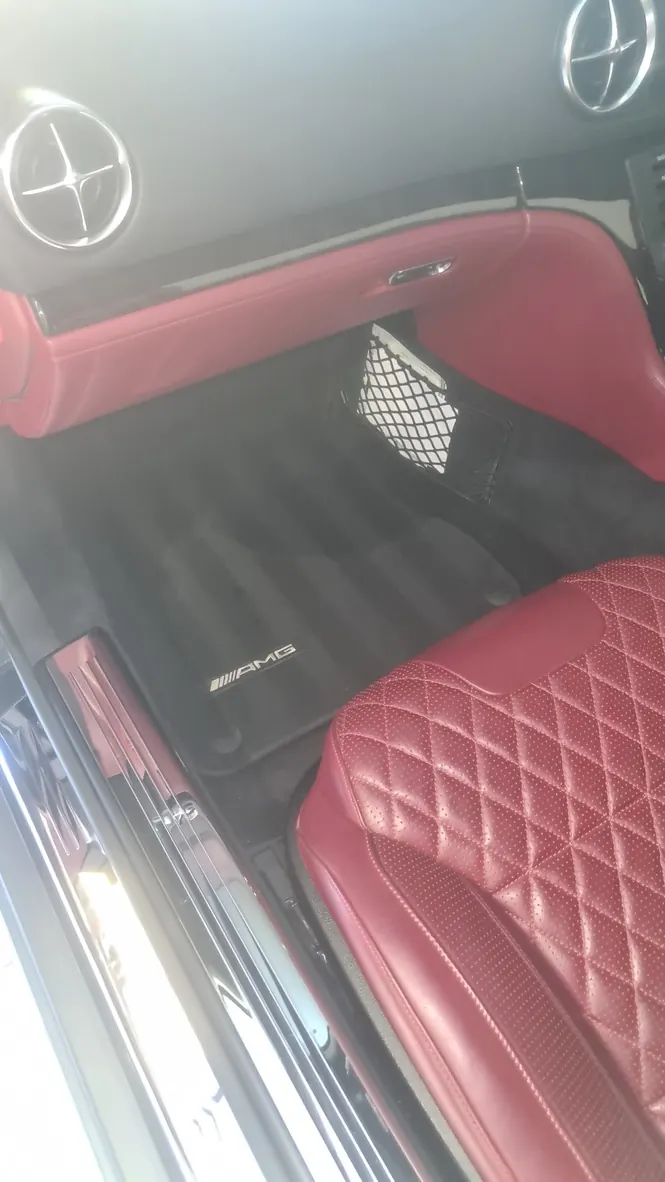 The red quilted leather cabin of a Mercedes-AMG SL 65 after cleaning and conditioning